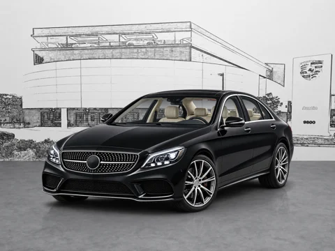 Black sedan in city dealership setting