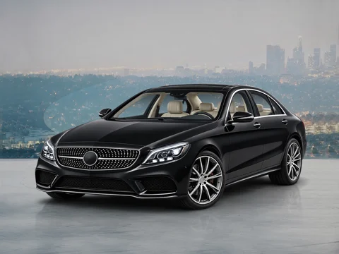 Black sedan in waterfront skyline setting